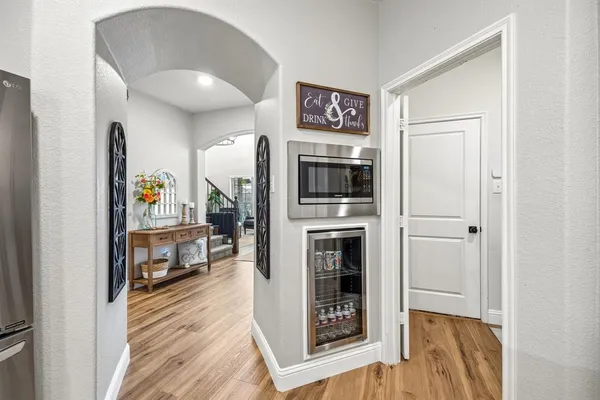 a open kitchen with a stove and a refrigerator