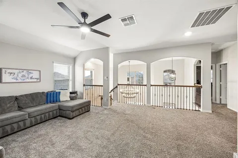 a living room with furniture and white walls