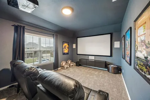 a room with furniture and a flat screen tv