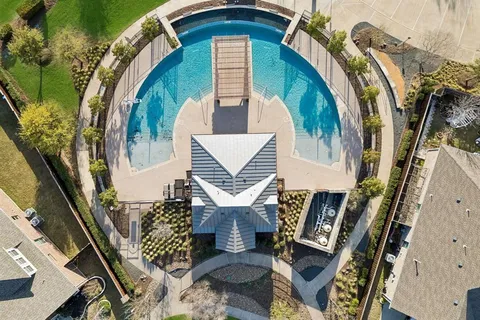 an aerial view of a house with outdoor space