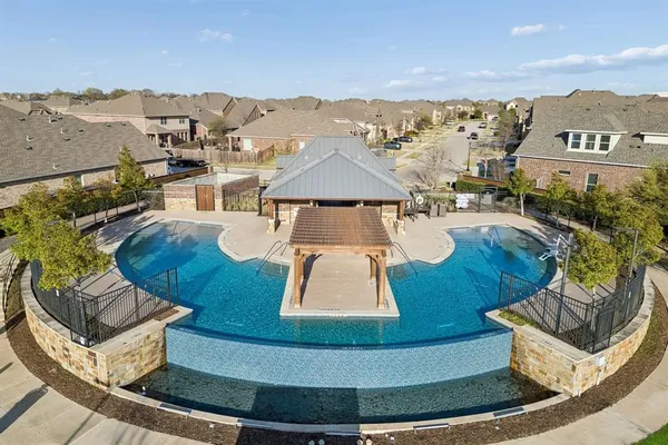 a view of a swimming pool with lounge chair