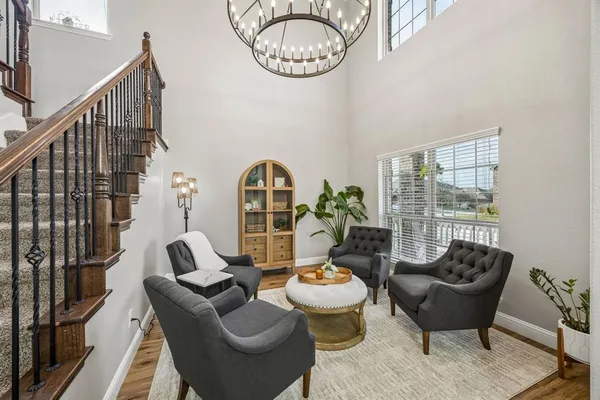 a living room with furniture and a large window