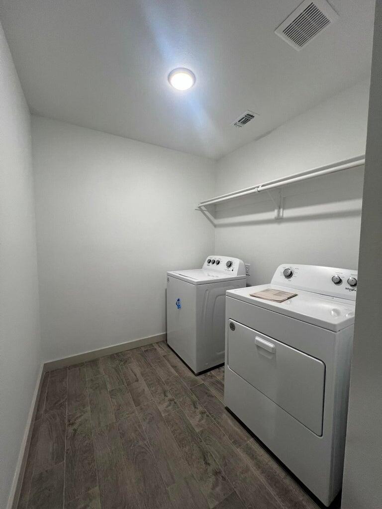 10518 Aberdeen Avenue Lubbock, TX 79424 - Photo 12 of 20 a utility room with dryer and washer