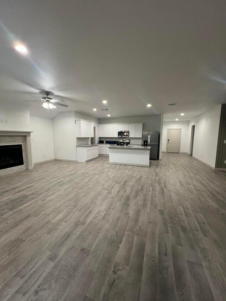 10518 Aberdeen Avenue Lubbock, TX 79424 - Photo 8 of 20 a view of a kitchen with a sink and a stove top oven