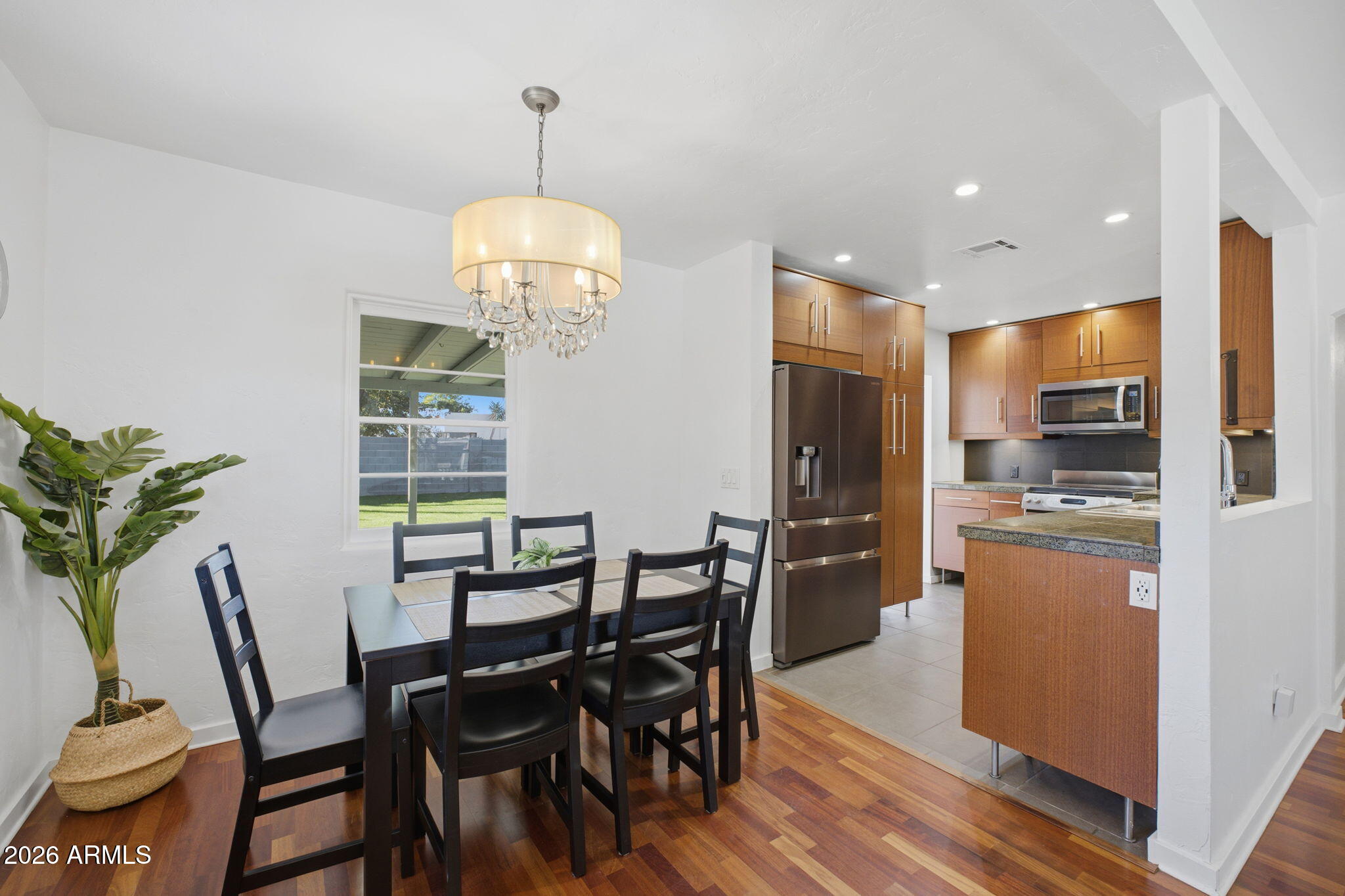 427 East Oregon Avenue Phoenix, AZ 85012 - Photo 8 of 32 a view of a dining room with furniture window and wooden floor