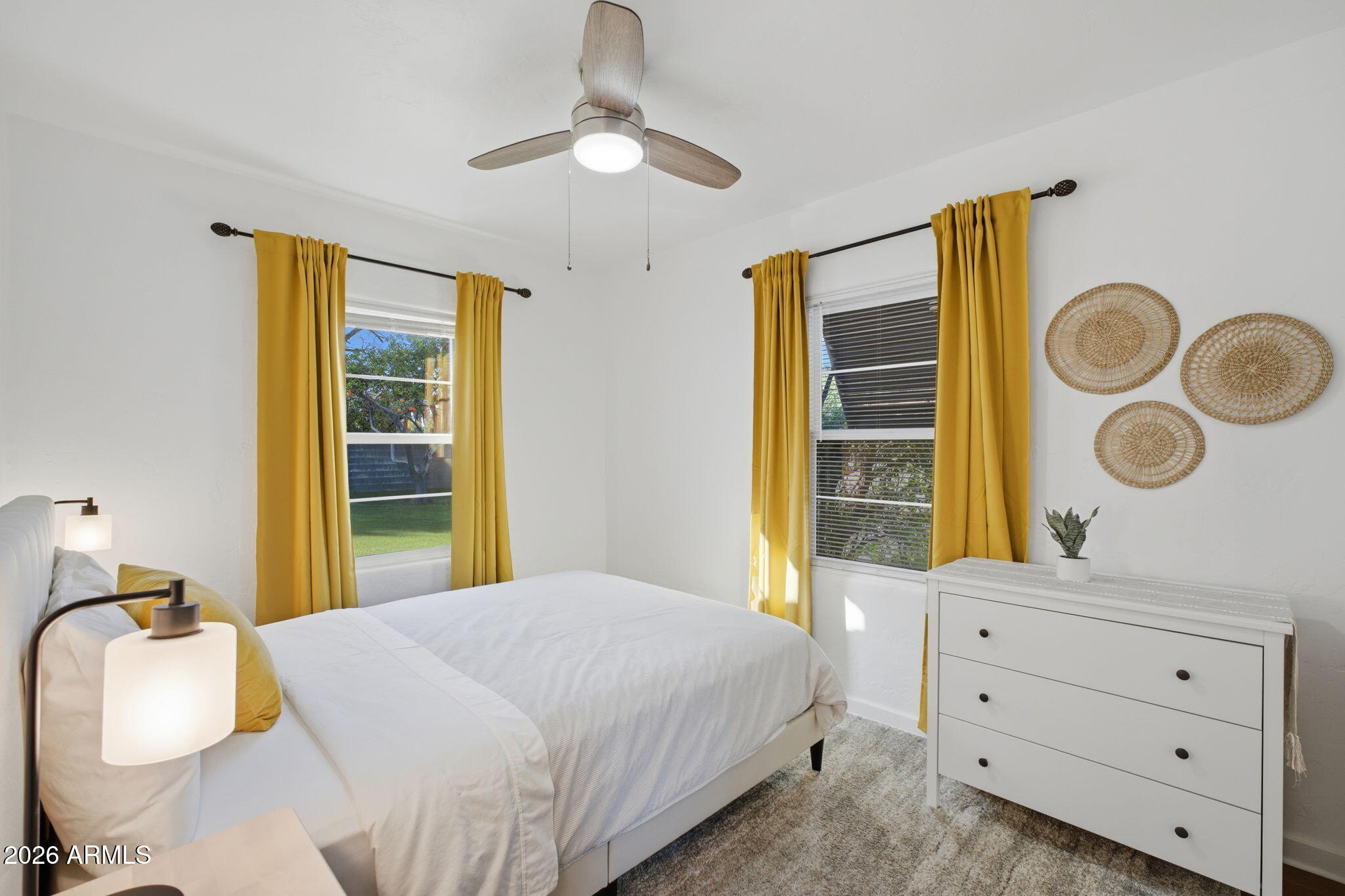 427 East Oregon Avenue Phoenix, AZ 85012 - Photo 15 of 32 a bedroom with a bed and a window