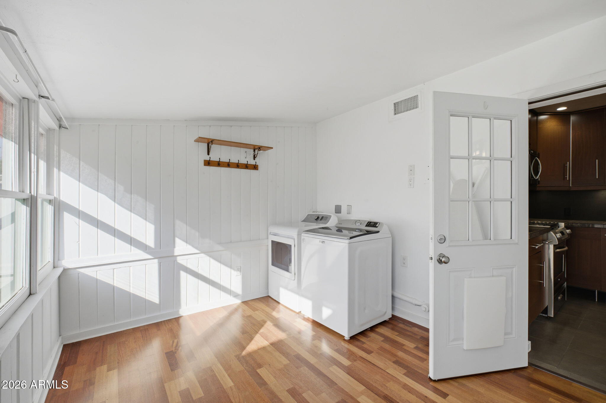 427 East Oregon Avenue Phoenix, AZ 85012 - Photo 18 of 32 a view of a hallway with wooden floor and entryway