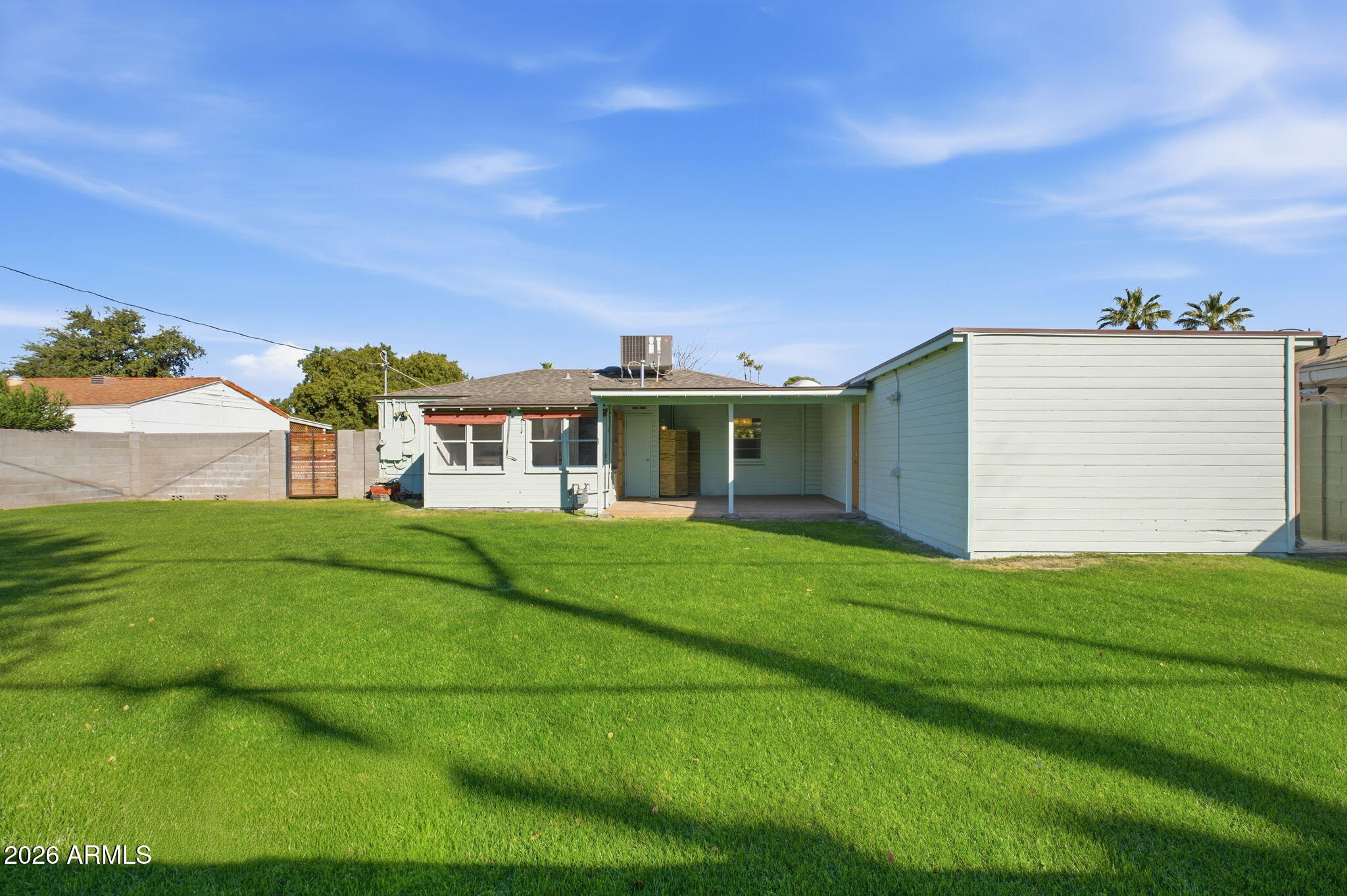 427 East Oregon Avenue Phoenix, AZ 85012 - Photo 24 of 32 a front view of a house with a yard