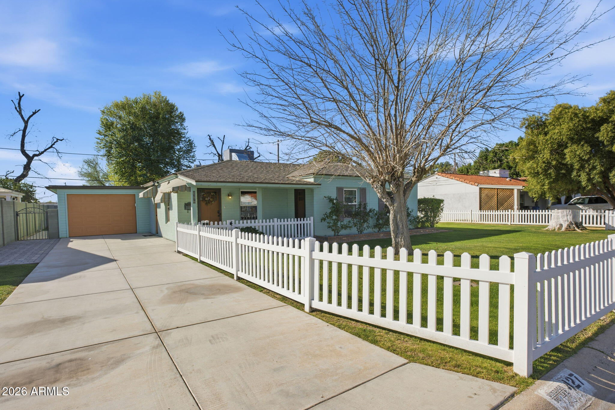 427 East Oregon Avenue Phoenix, AZ 85012 - Photo 2 of 32 a view of a house with a yard
