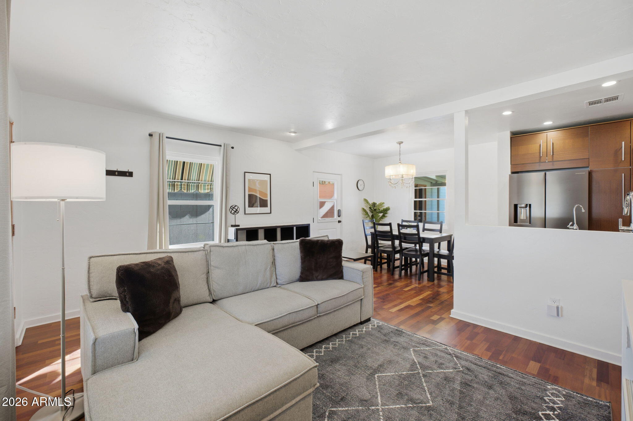 427 East Oregon Avenue Phoenix, AZ 85012 - Photo 5 of 32 a living room with furniture and a wooden floor