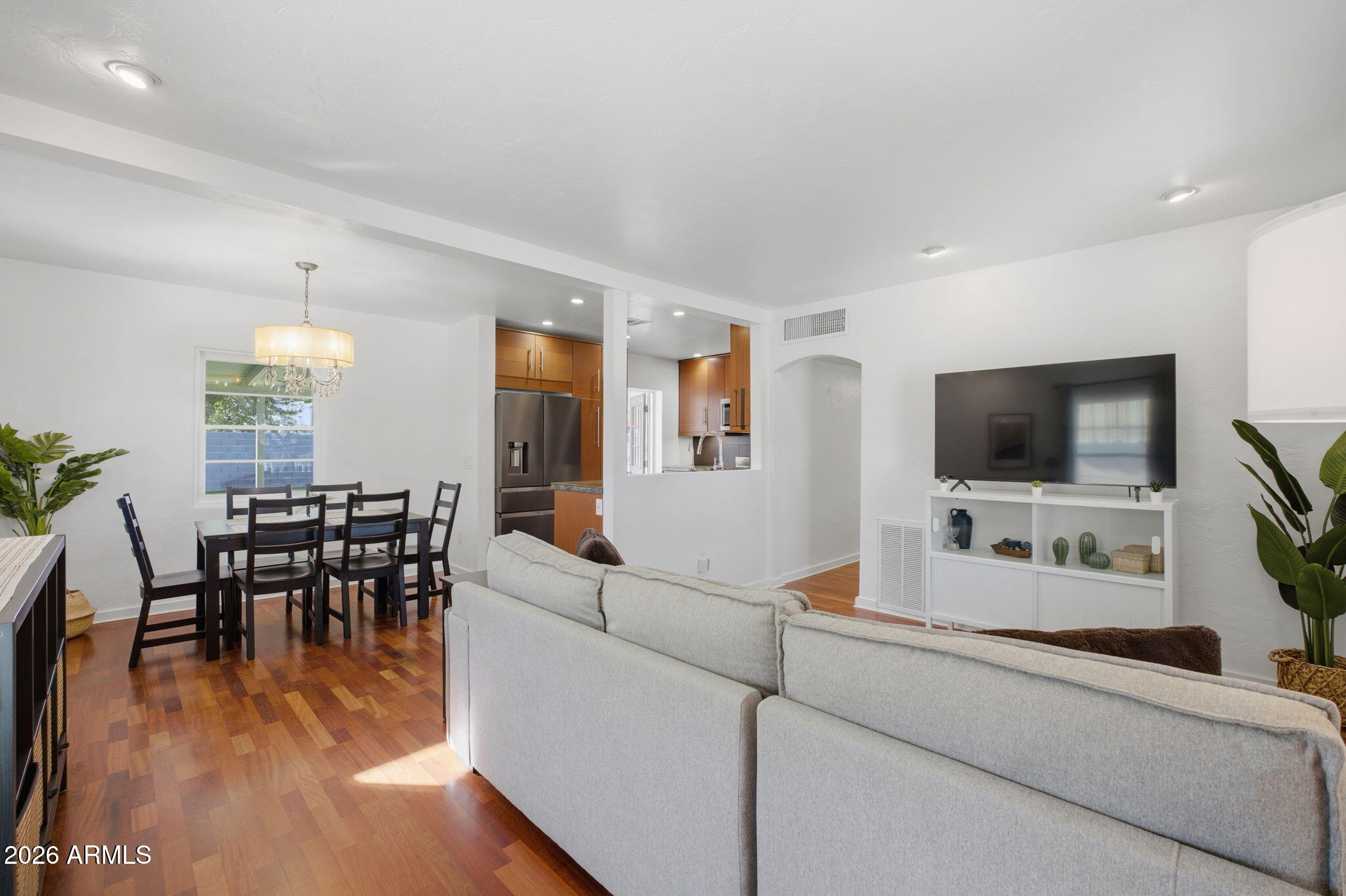 427 East Oregon Avenue Phoenix, AZ 85012 - Photo 31 of 32 a living room with furniture and a flat screen tv