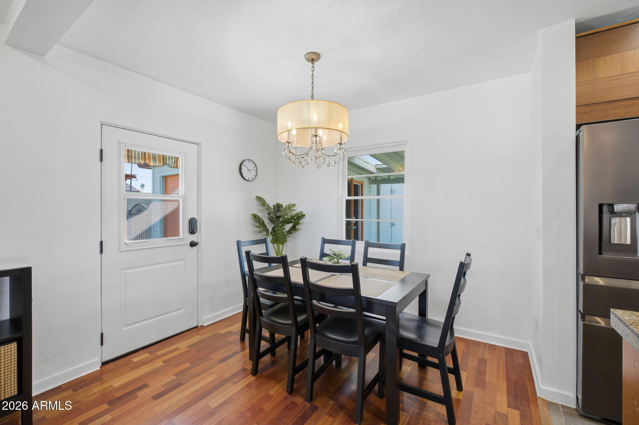 427 East Oregon Avenue Phoenix, AZ 85012 - Photo 7 of 32 a view of a dining room with furniture and wooden floor
