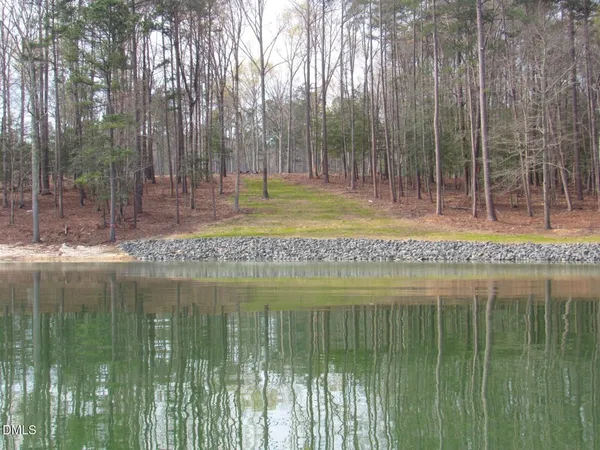 a view of a lake and a yard