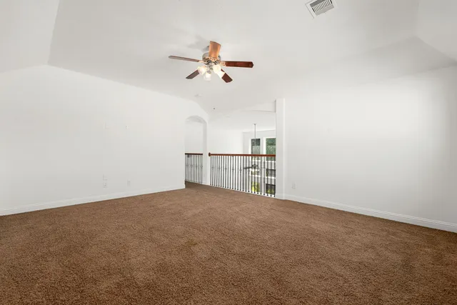 a view of a kitchen with a dishwasher cabinets and a ceiling fan