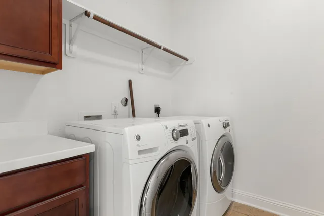 a view of storage and utility room with washer and dryer