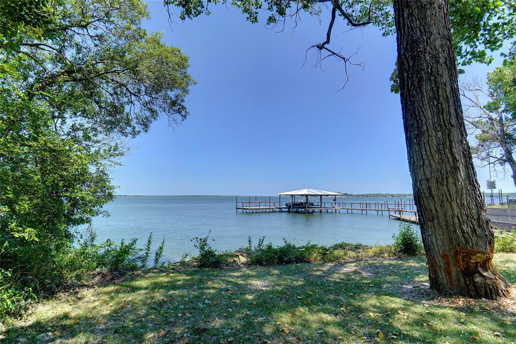 a view of a lake with houses in outdoor space