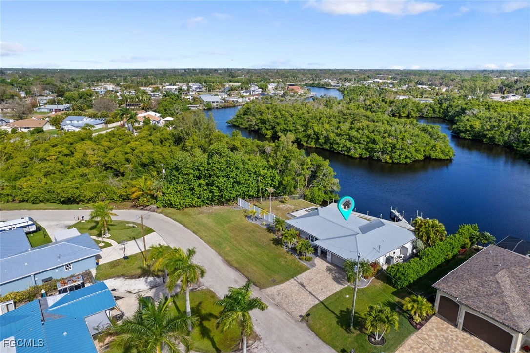 432 Seaworthy Road North Fort Myers, FL 33903 - Photo 24 of 28 an aerial view of a house with a lake view
