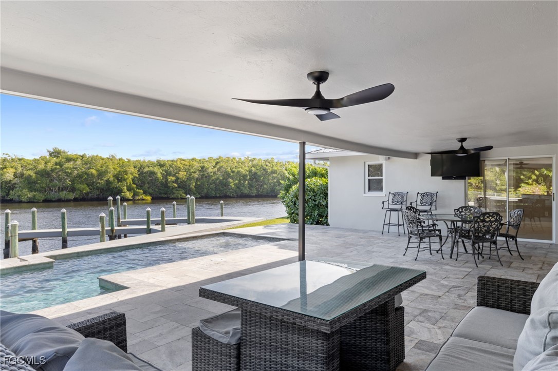 432 Seaworthy Road North Fort Myers, FL 33903 - Photo 28 of 28 a living room with lots of furniture and a large window
