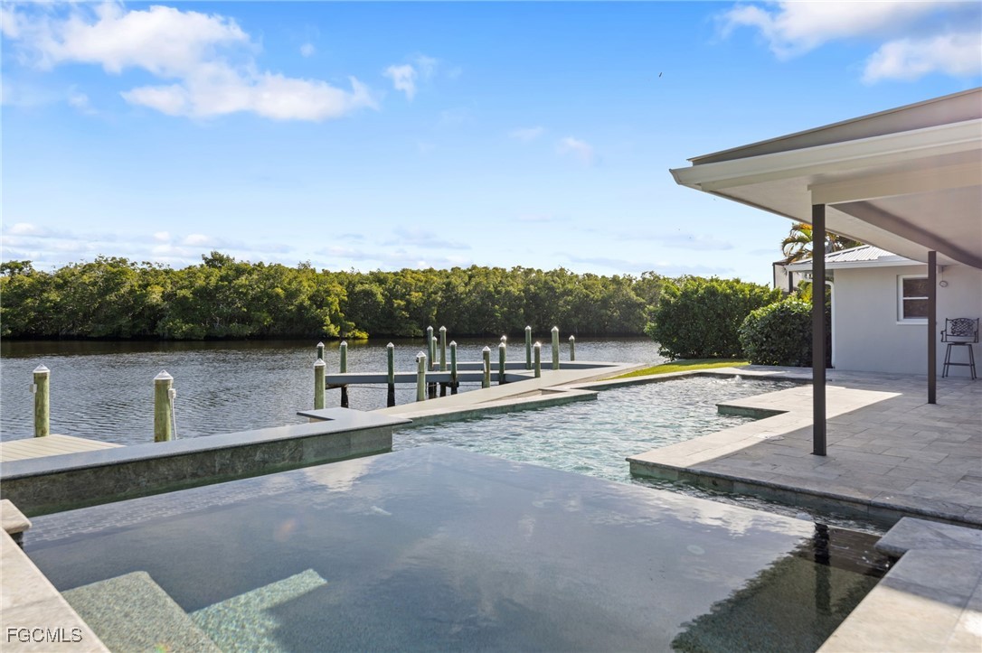 432 Seaworthy Road North Fort Myers, FL 33903 - Photo 8 of 28 a view of a terrace with a garden