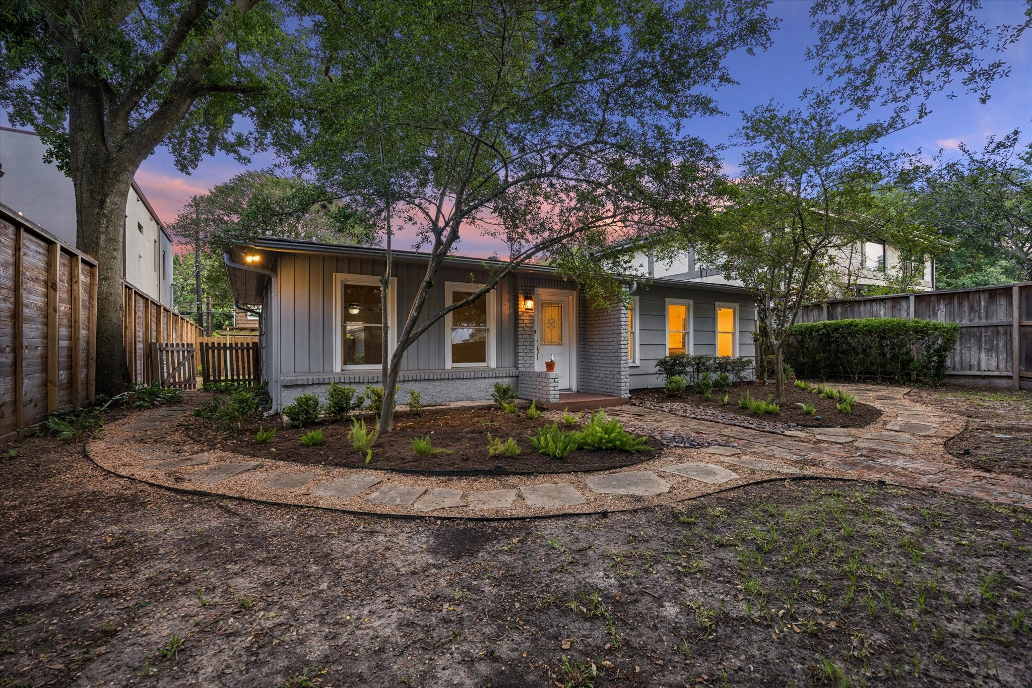 1931 Bissonnet Street Houston, TX 77005 - Photo 2 of 22 a front view of a house with garden