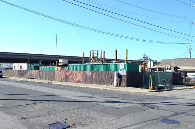 a view of street with tall buildings