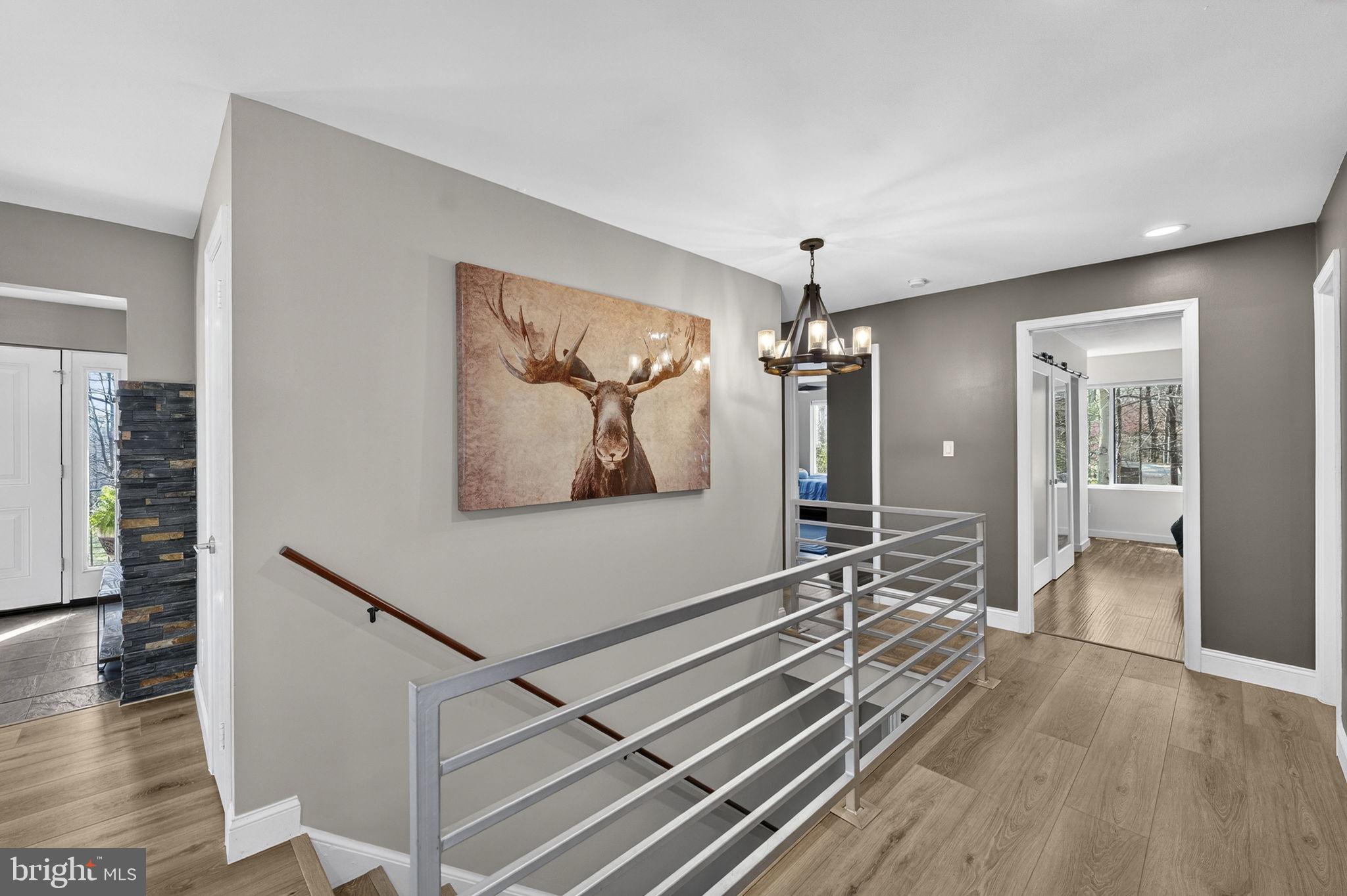 7427 Maple Branch Road Clifton, VA 20124 - Photo 33 of 100 Main Level Hallway Opens to Primary Bedroom