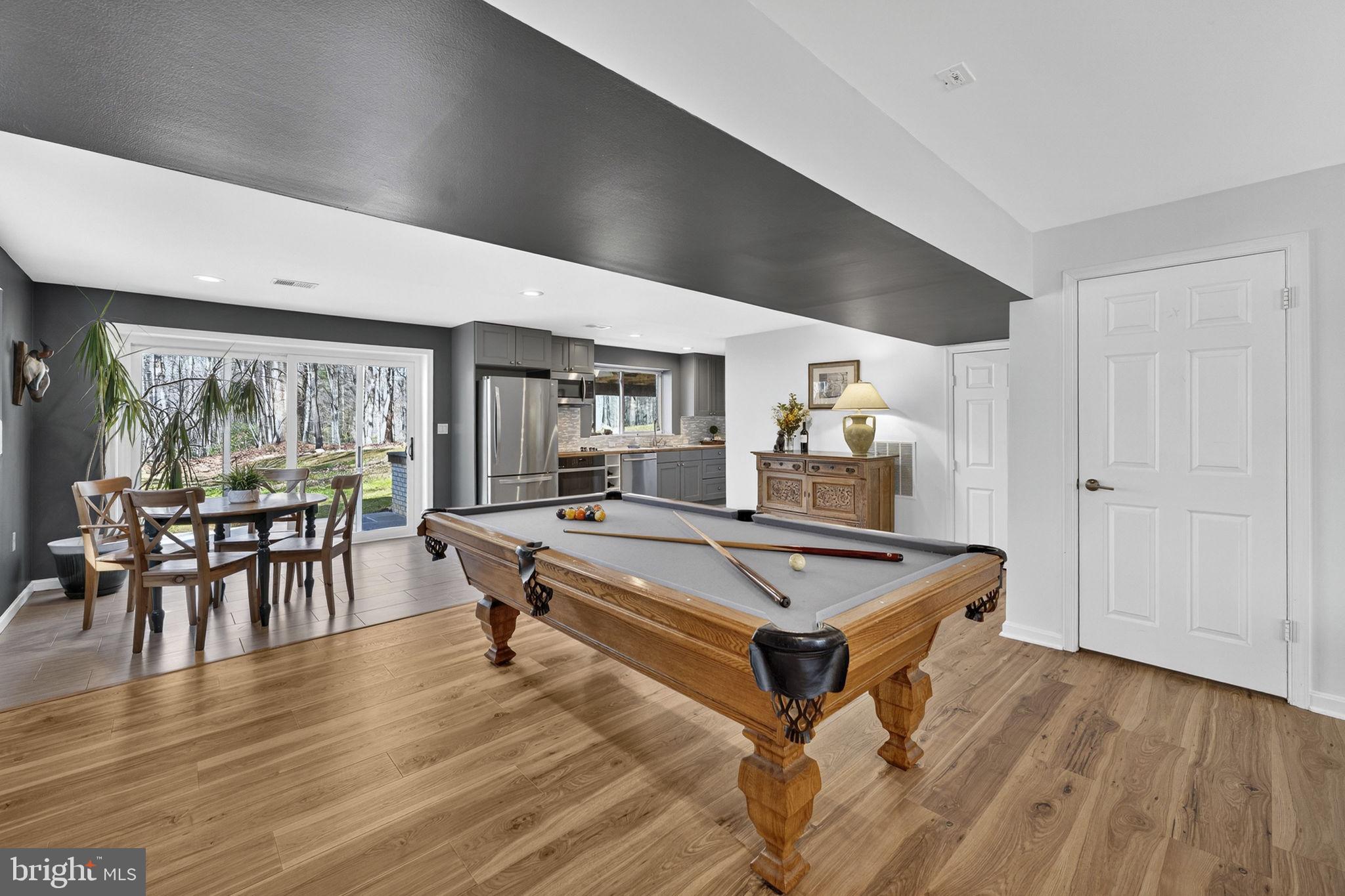 7427 Maple Branch Road Clifton, VA 20124 - Photo 63 of 100 LL Rec Room Opens to Dining Area & 2nd Kitchen