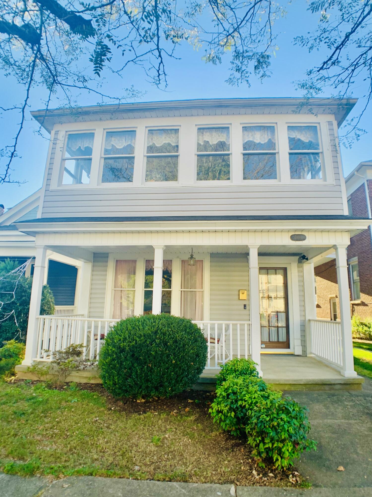709 McCormick Boulevard Clifton Forge, VA 24422 - Photo 2 of 74 front view of a brick house with a yard