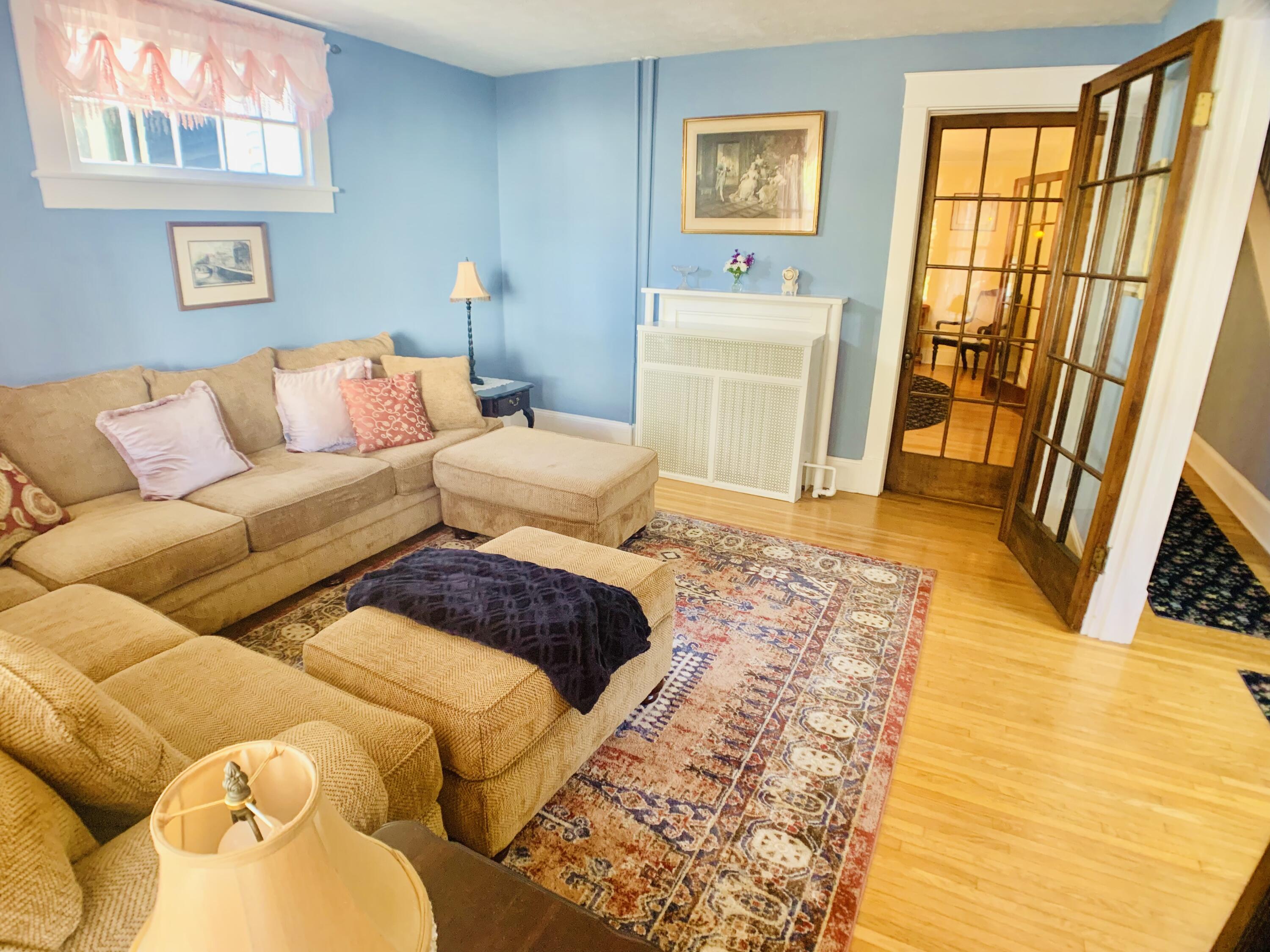 709 McCormick Boulevard Clifton Forge, VA 24422 - Photo 14 of 74 a living room with a couch and a dresser next to a window