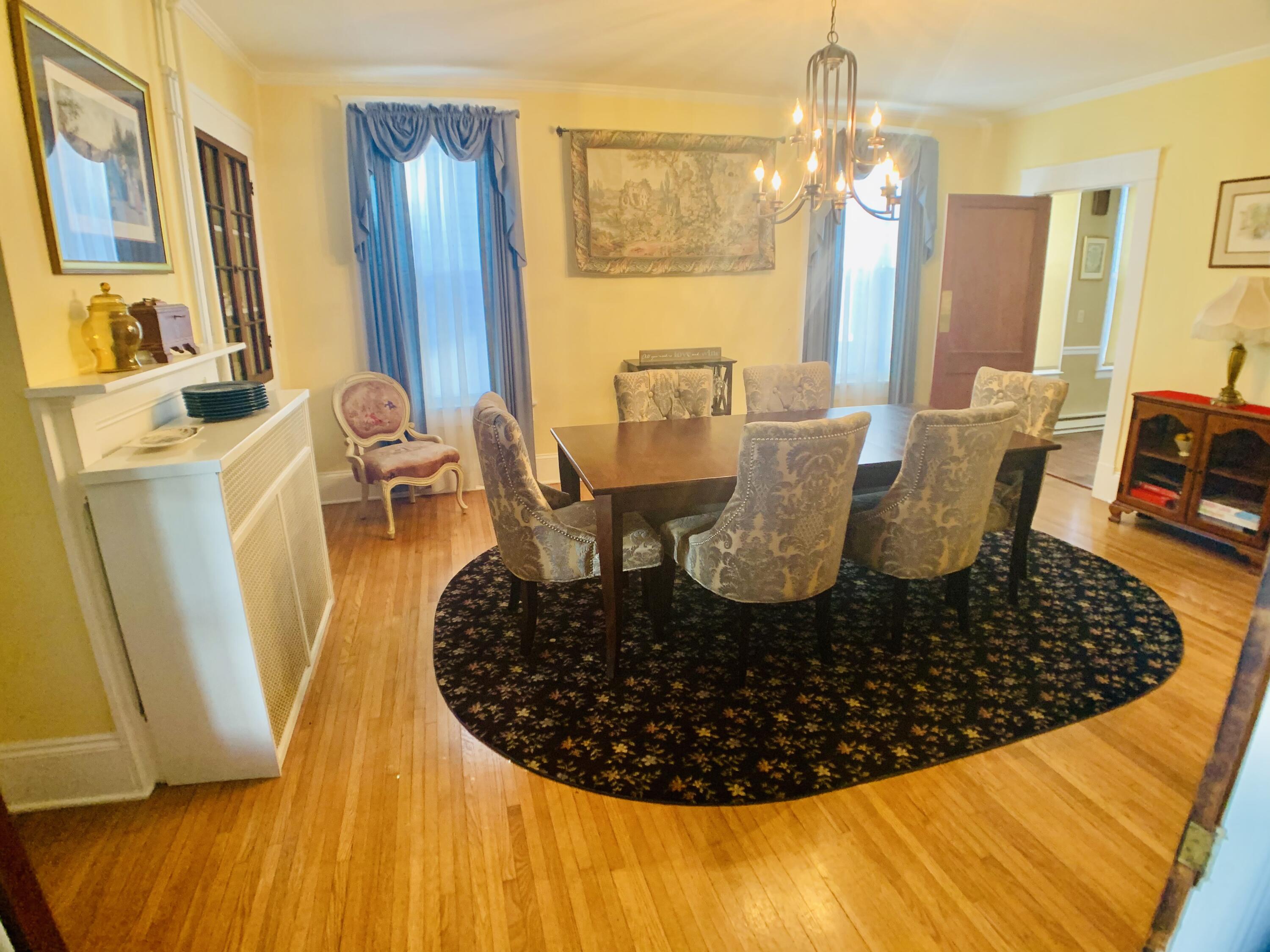 709 McCormick Boulevard Clifton Forge, VA 24422 - Photo 18 of 74 a view of a dining room with furniture wooden floor and a chandelier