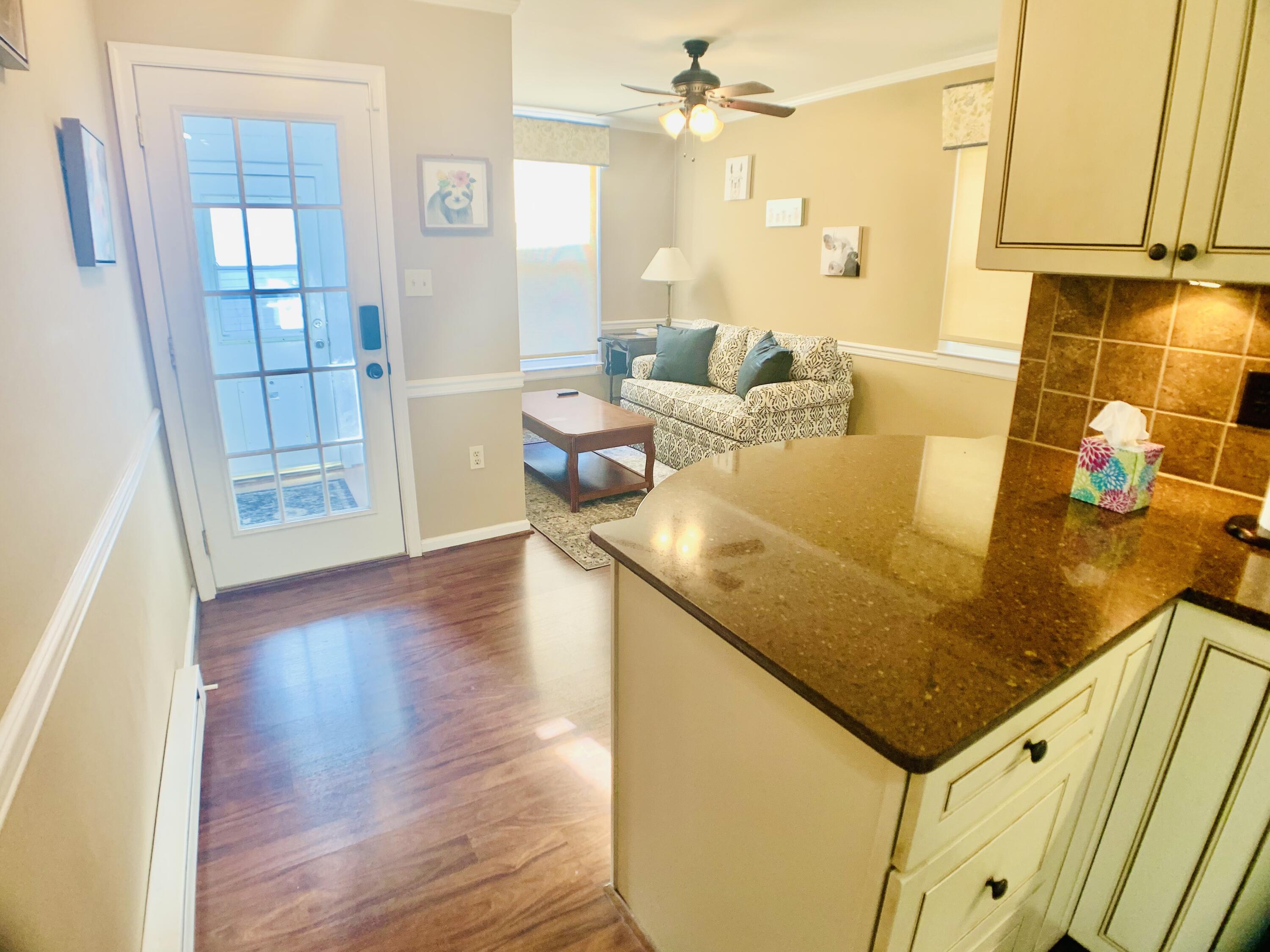 709 McCormick Boulevard Clifton Forge, VA 24422 - Photo 22 of 74 a living room with a table chairs and wooden floor