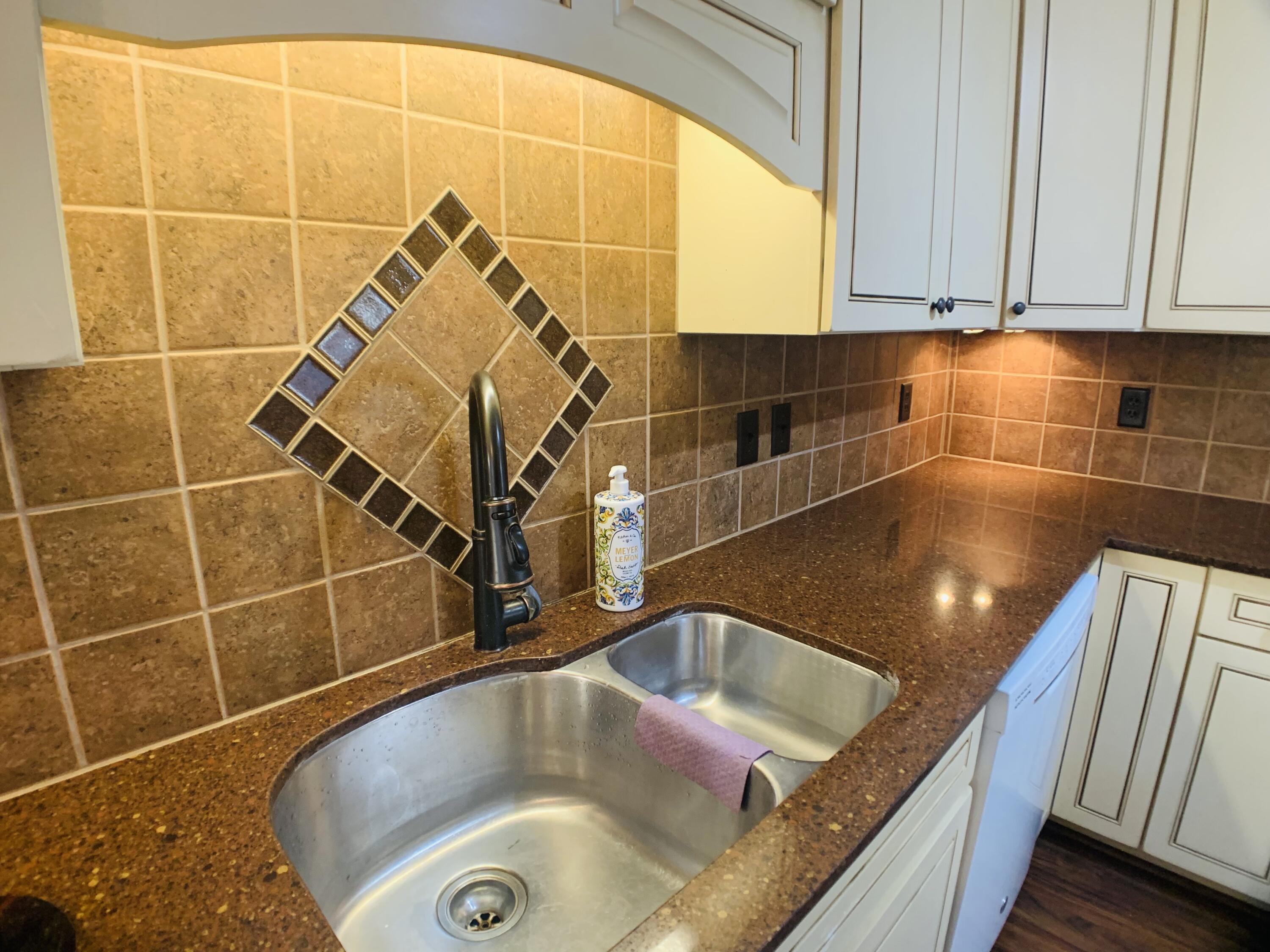 709 McCormick Boulevard Clifton Forge, VA 24422 - Photo 26 of 74 a bathroom with a granite countertop sink and a bathtub
