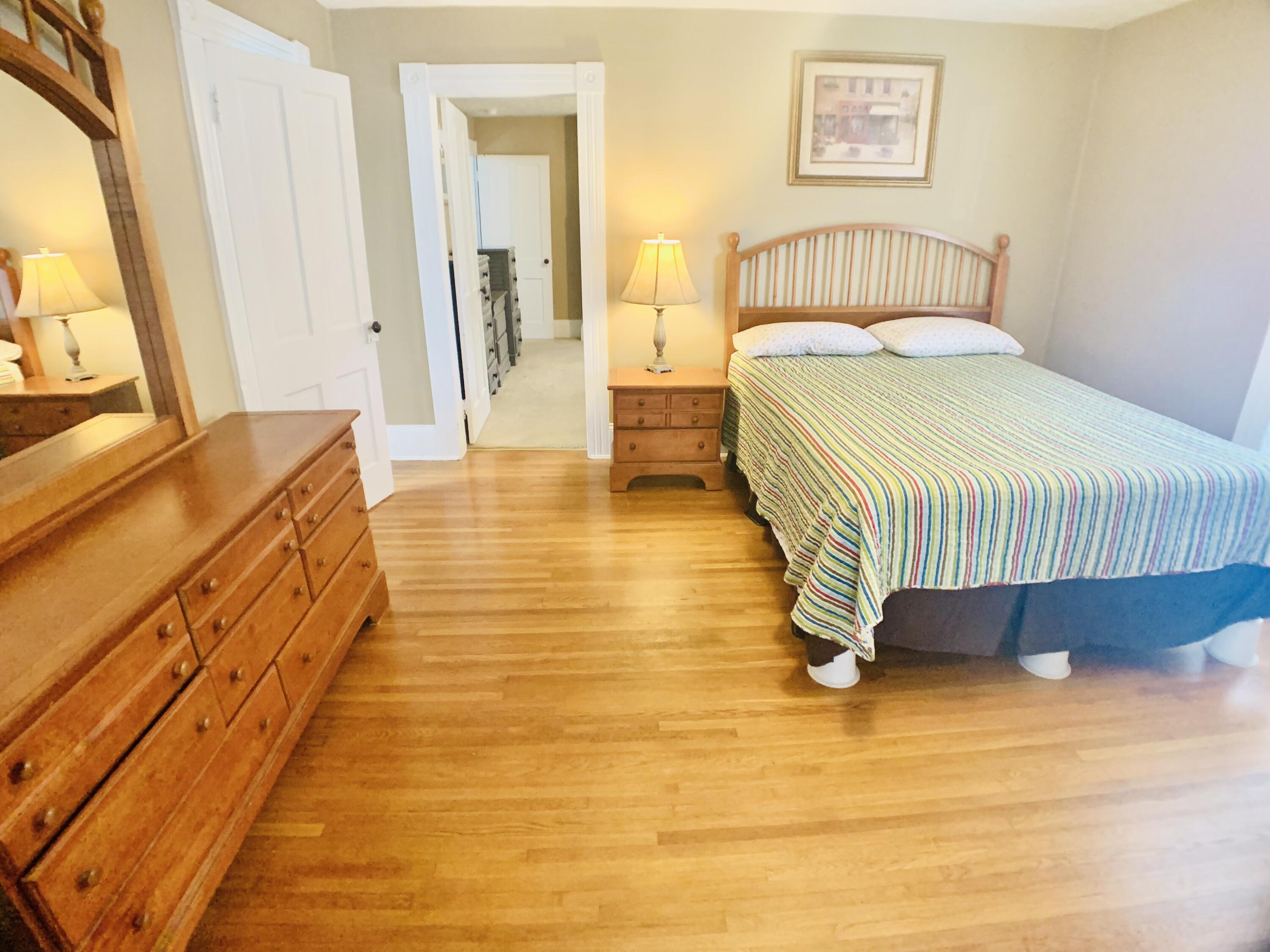 709 McCormick Boulevard Clifton Forge, VA 24422 - Photo 43 of 74 a spacious bedroom with a bed and a table in it