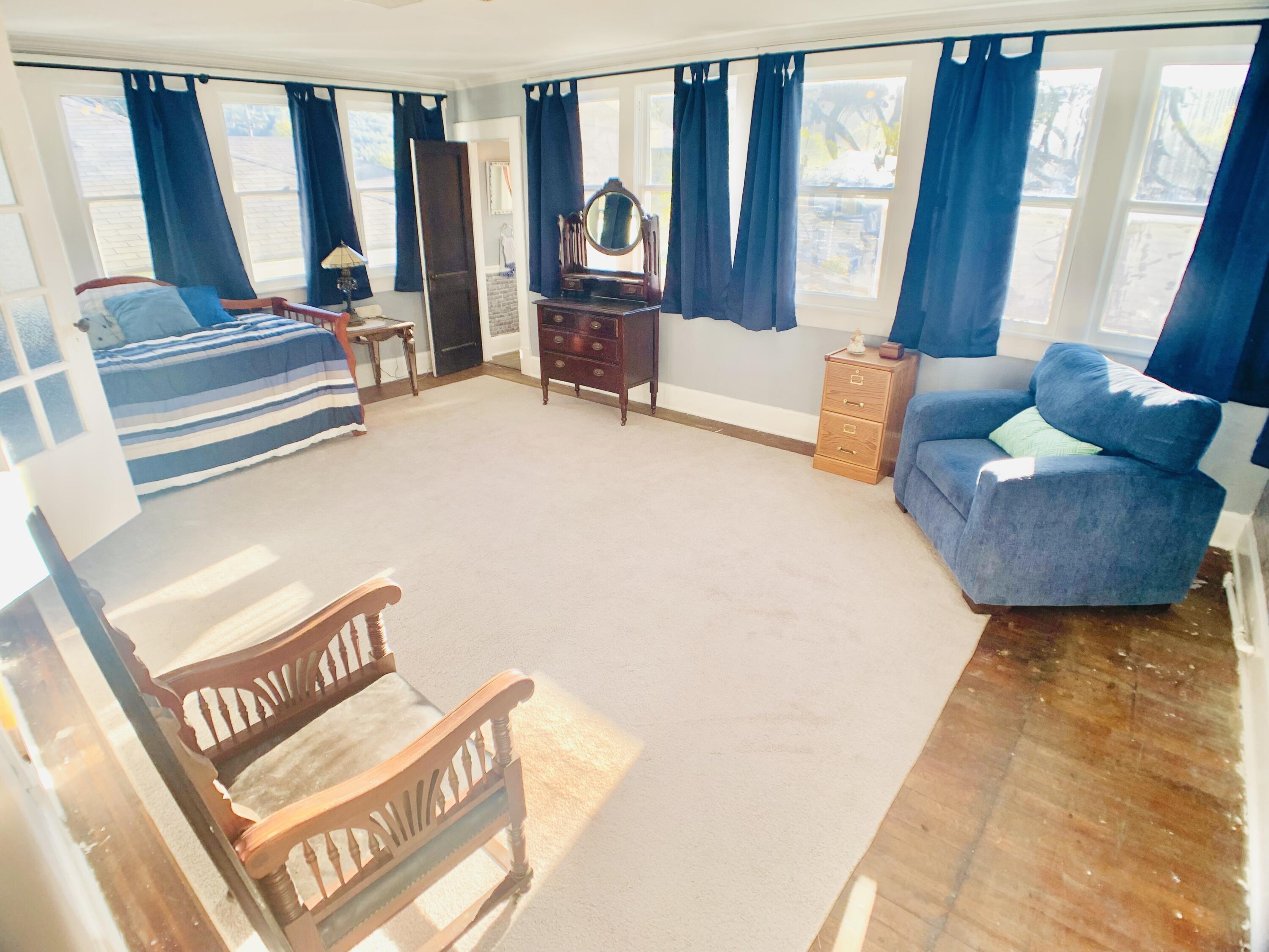 709 McCormick Boulevard Clifton Forge, VA 24422 - Photo 45 of 74 a living room with furniture and large windows