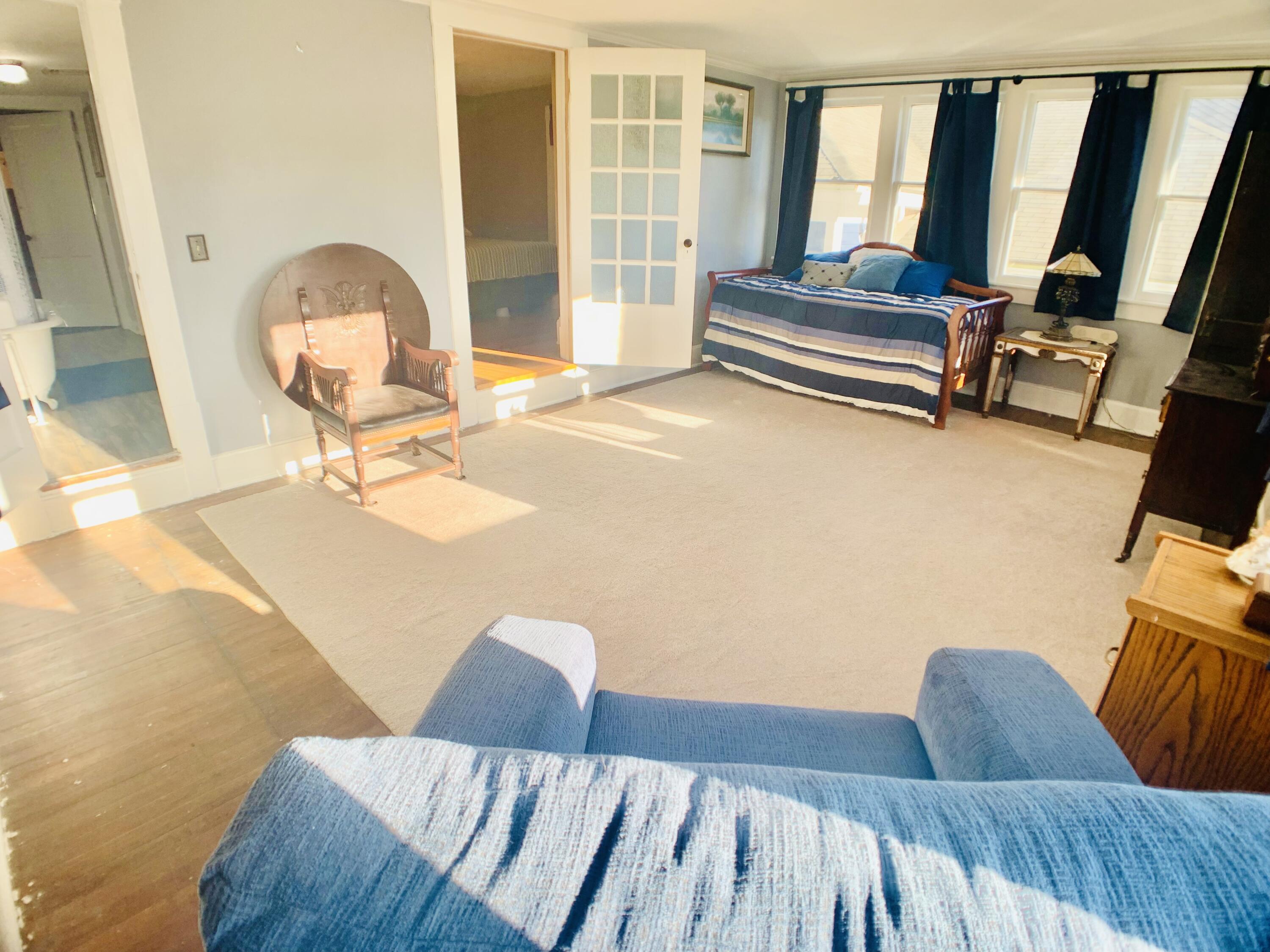 709 McCormick Boulevard Clifton Forge, VA 24422 - Photo 46 of 74 a living room with furniture and a floor to ceiling window