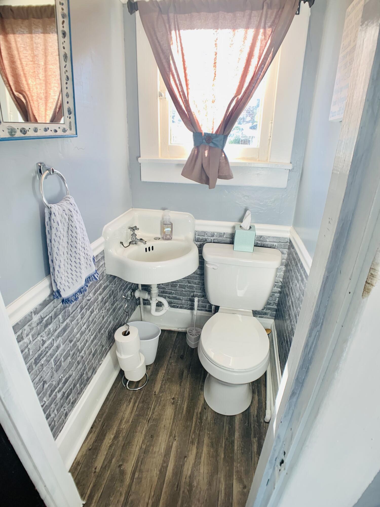 709 McCormick Boulevard Clifton Forge, VA 24422 - Photo 49 of 74 a bathroom with a toilet sink and mirror