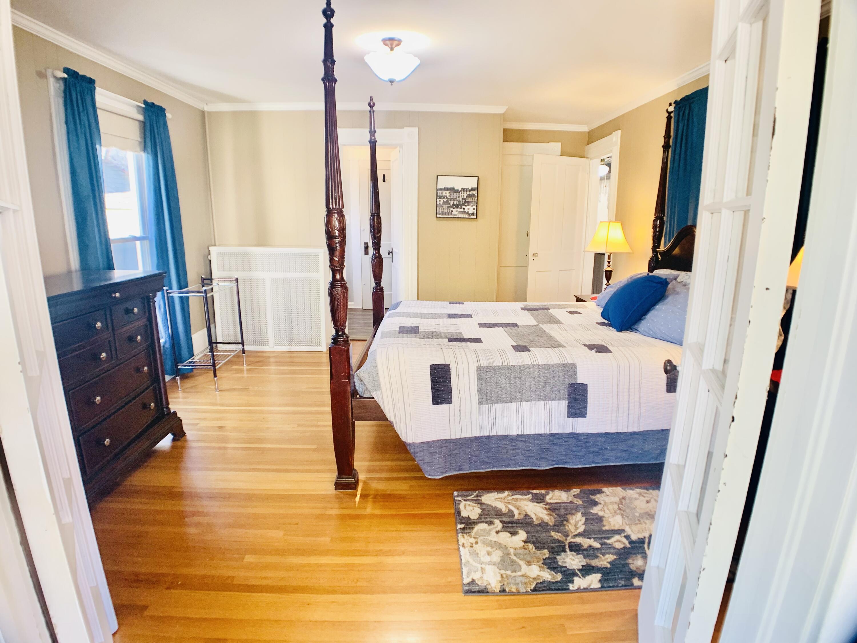 709 McCormick Boulevard Clifton Forge, VA 24422 - Photo 53 of 74 a living room with a baby crib furniture a fireplace and a large window