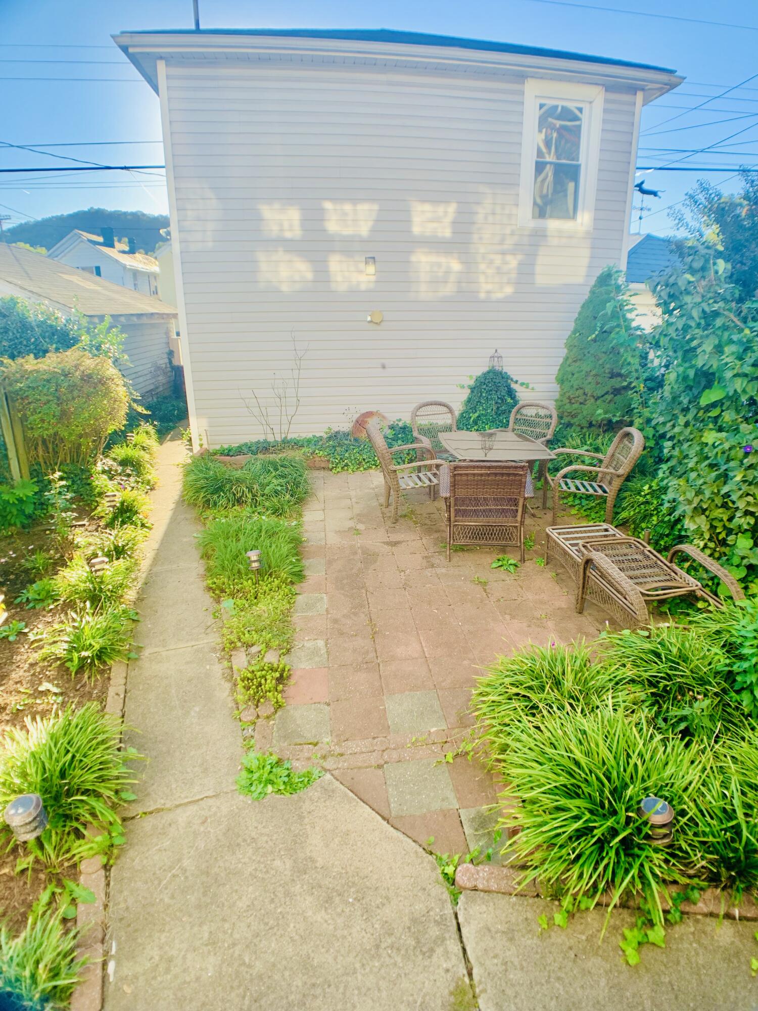 709 McCormick Boulevard Clifton Forge, VA 24422 - Photo 65 of 74 a view of a patio with plants and flowers
