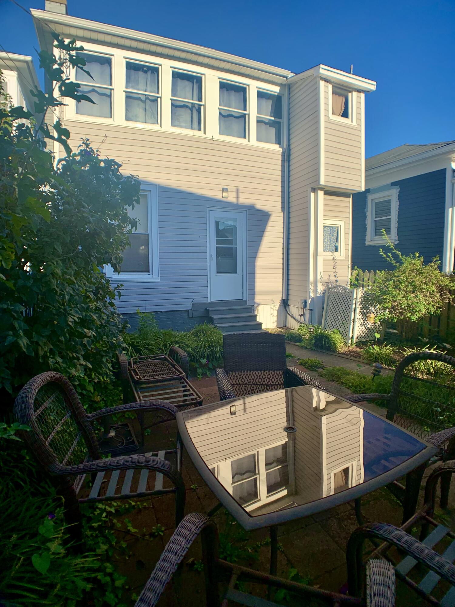 709 McCormick Boulevard Clifton Forge, VA 24422 - Photo 67 of 74 a view of a house with backyard sitting area and garden