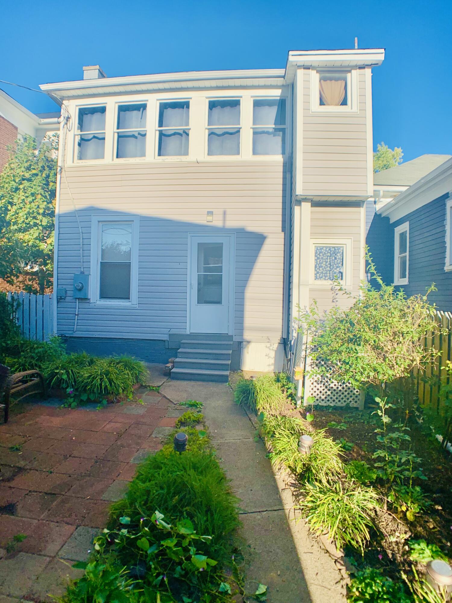 709 McCormick Boulevard Clifton Forge, VA 24422 - Photo 68 of 74 a view of a brick house with a yard and plants