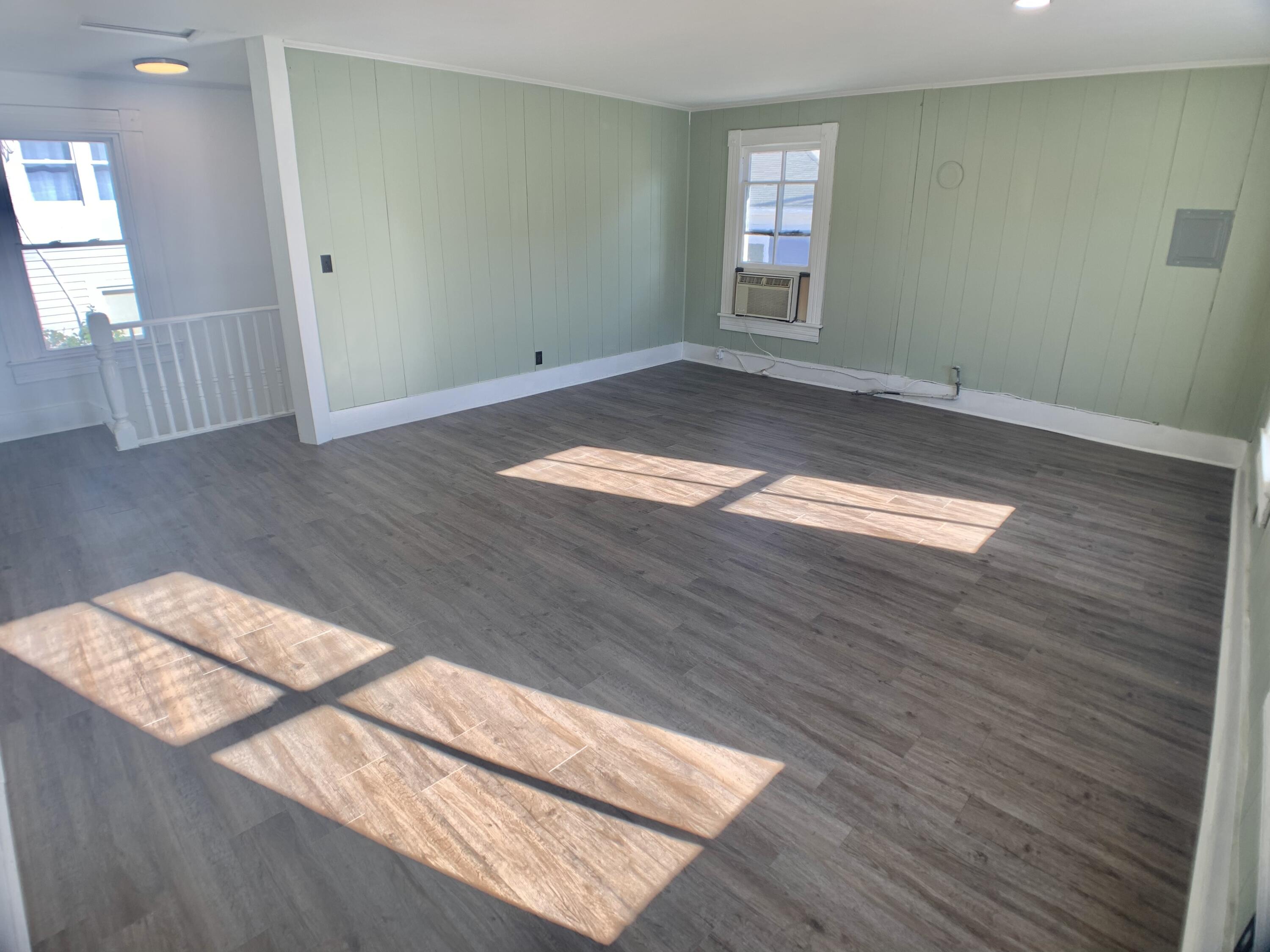 709 McCormick Boulevard Clifton Forge, VA 24422 - Photo 72 of 74 wooden floor in an empty room with a window