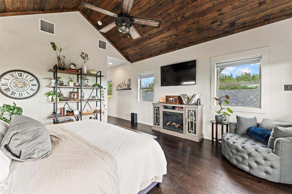 124 Bluffview Circle China Spring, TX 76633 - Photo 28 of 40 Vaulted wood-plank ceiling with a ceiling fan, dark wood-finish flooring, and white walls