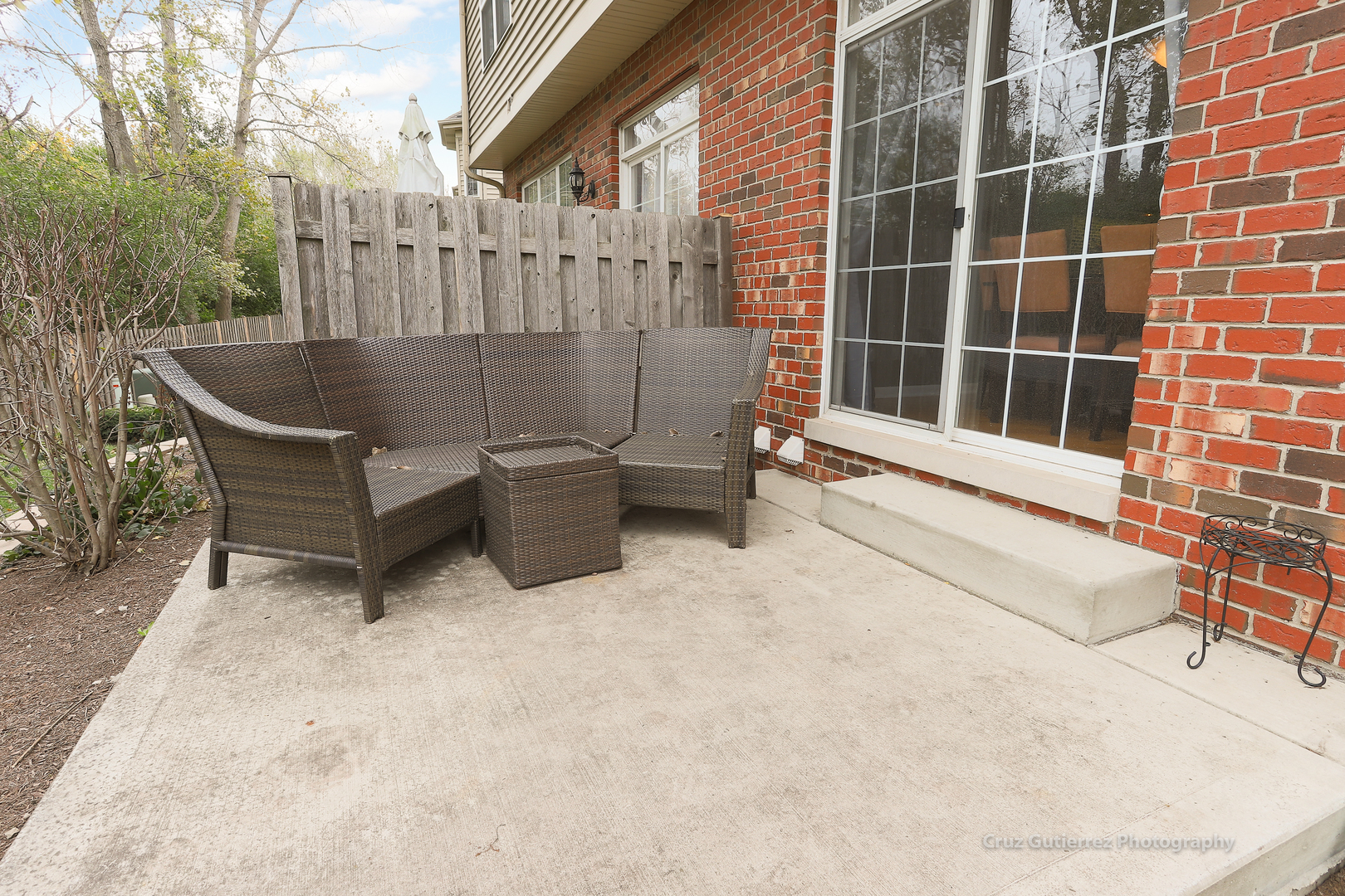 450 North River Road Naperville, IL 60540 - Photo 22 of 26 a view of a patio with a table and chairs