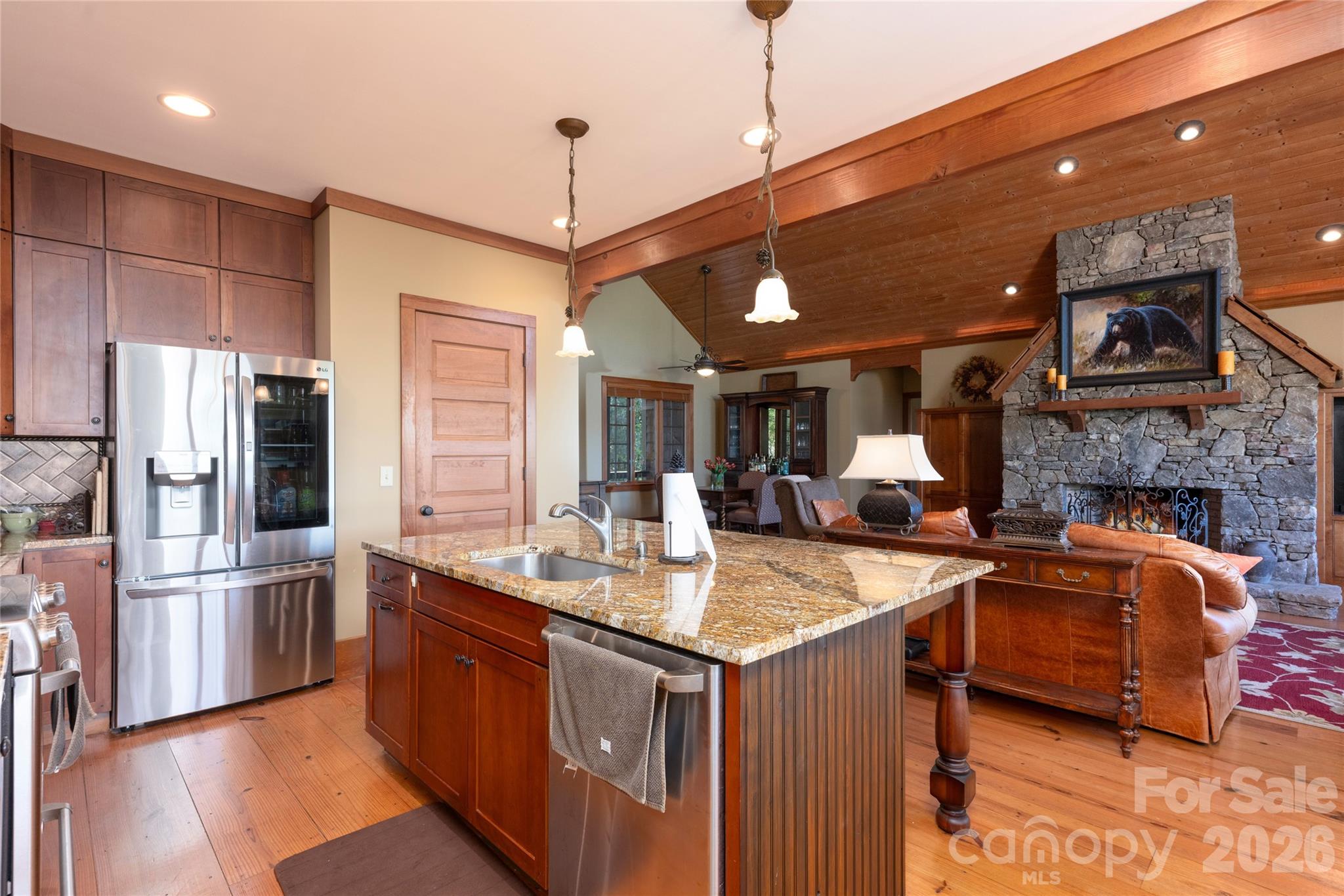 601 Hawk Mountain Road Lake Toxaway, NC 28747 - Photo 13 of 48 a kitchen with stainless steel appliances granite countertop a sink refrigerator and cabinets