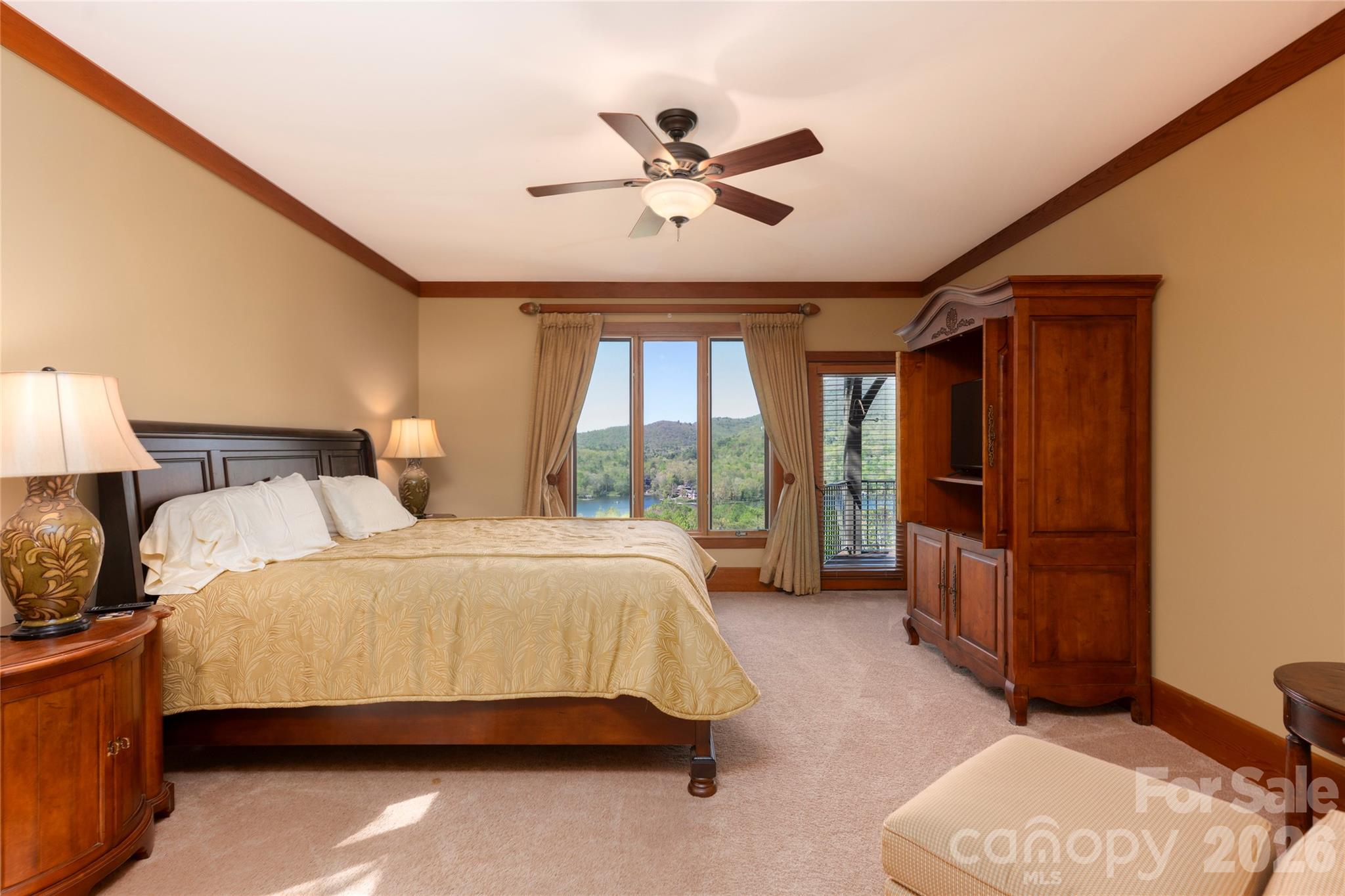 601 Hawk Mountain Road Lake Toxaway, NC 28747 - Photo 15 of 48 a bedroom with a bed and window