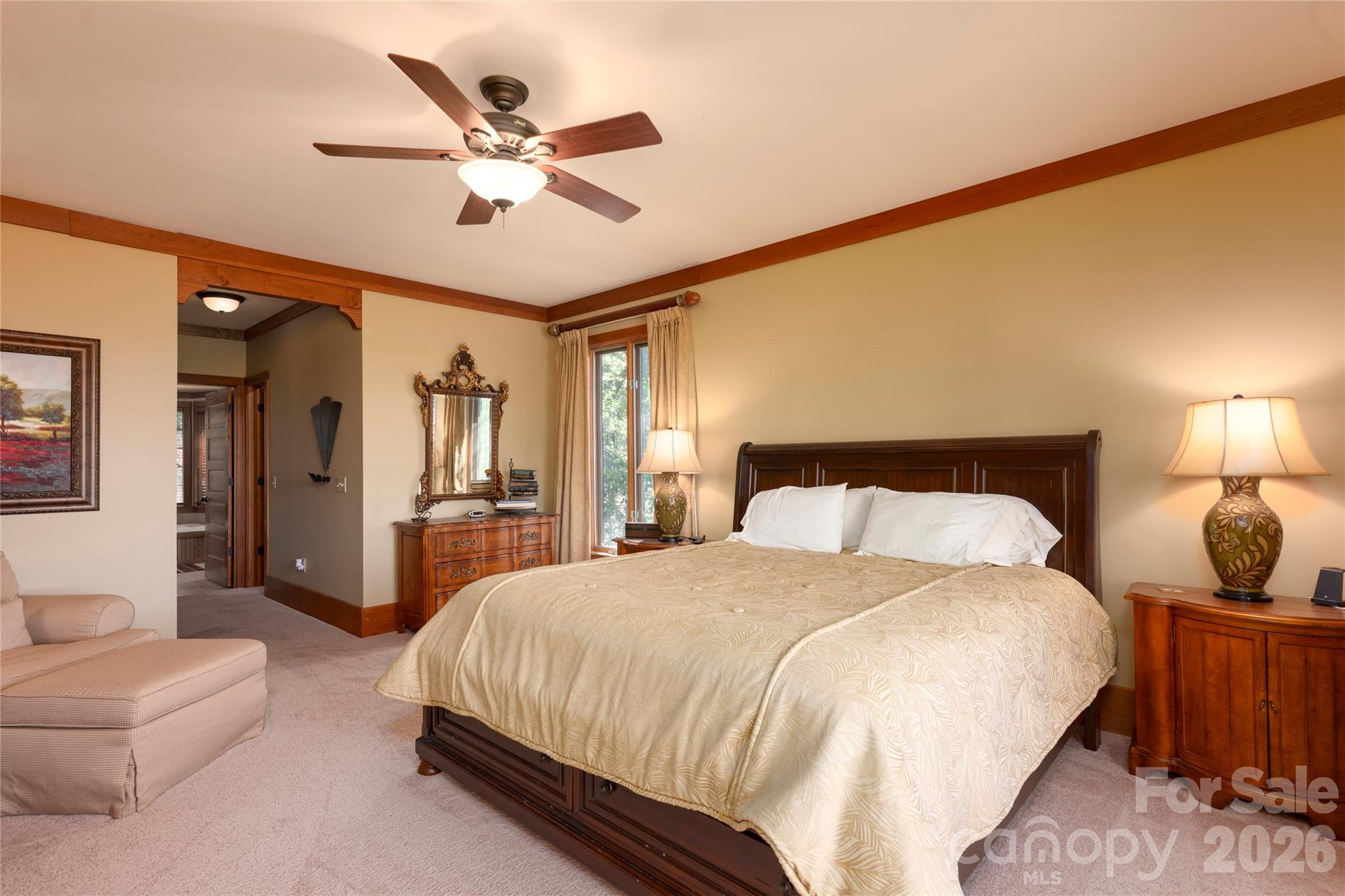 601 Hawk Mountain Road Lake Toxaway, NC 28747 - Photo 17 of 48 a spacious bedroom with a bed and ceiling fan