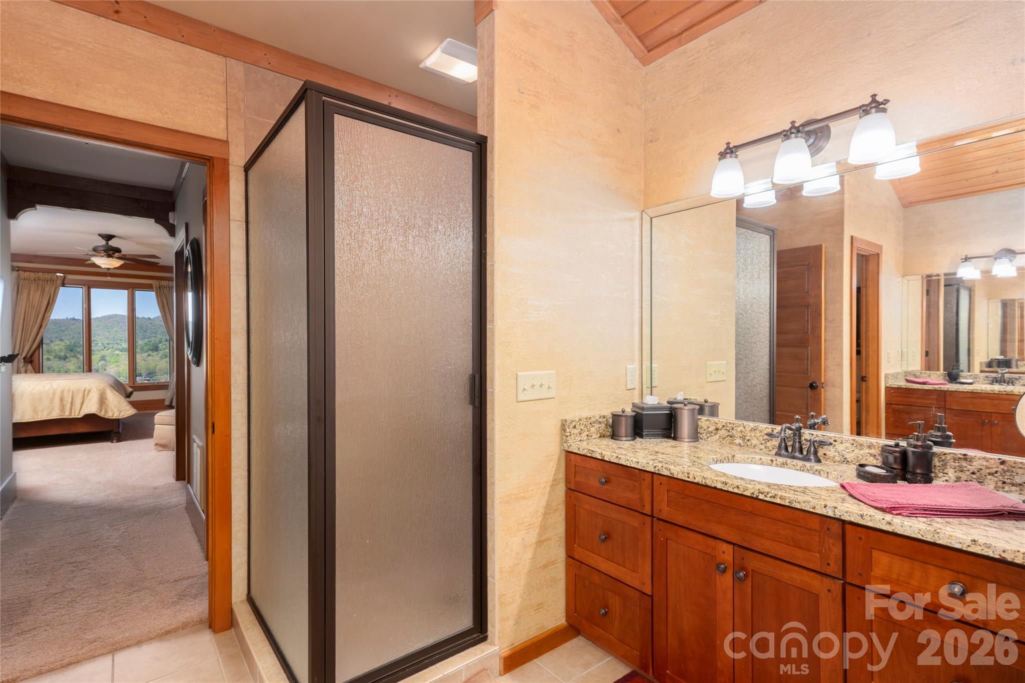 601 Hawk Mountain Road Lake Toxaway, NC 28747 - Photo 19 of 48 a bathroom with a double vanity sink and a mirror