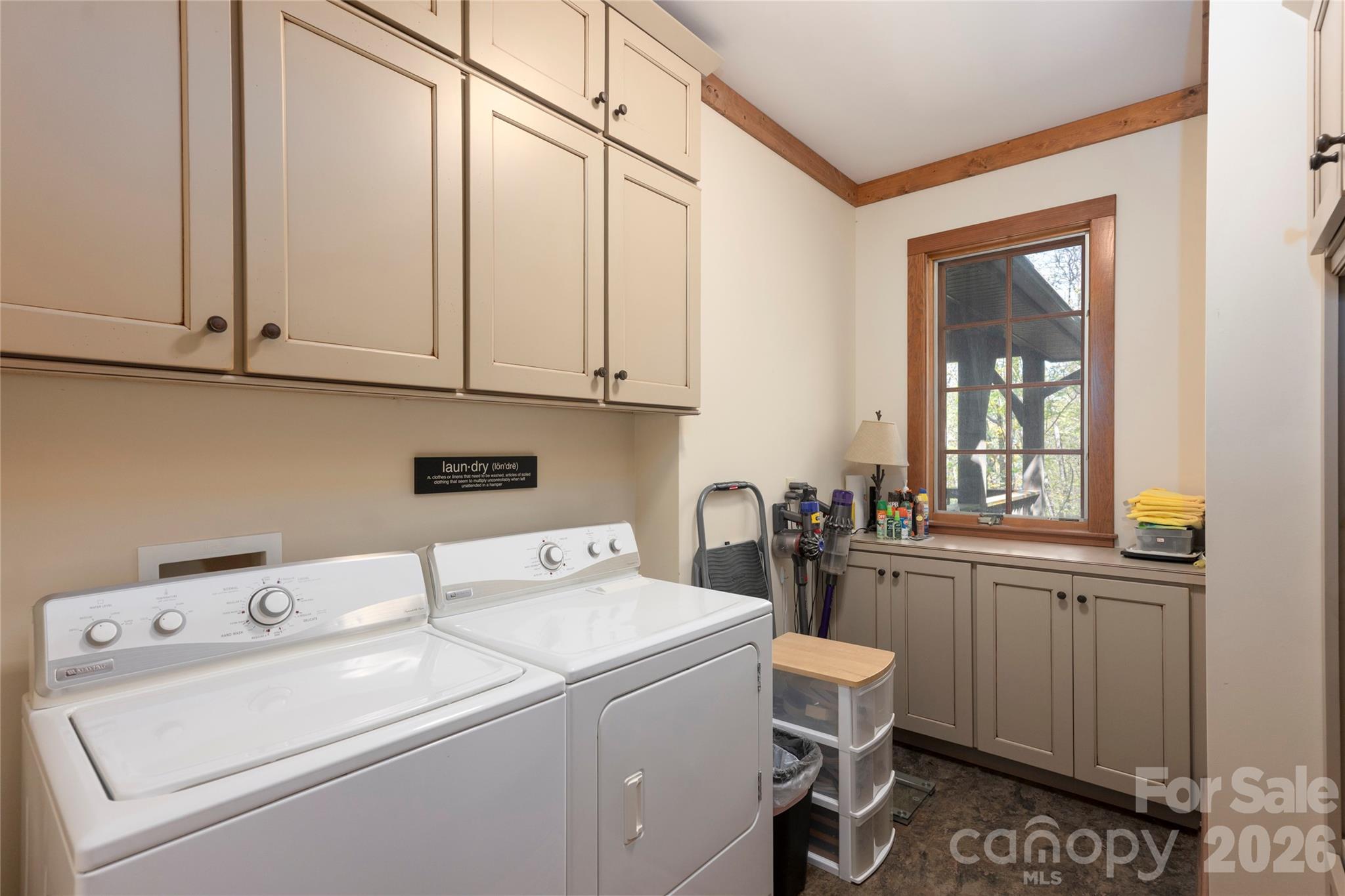 601 Hawk Mountain Road Lake Toxaway, NC 28747 - Photo 21 of 48 a view of washer and dryer with bathroom in the background