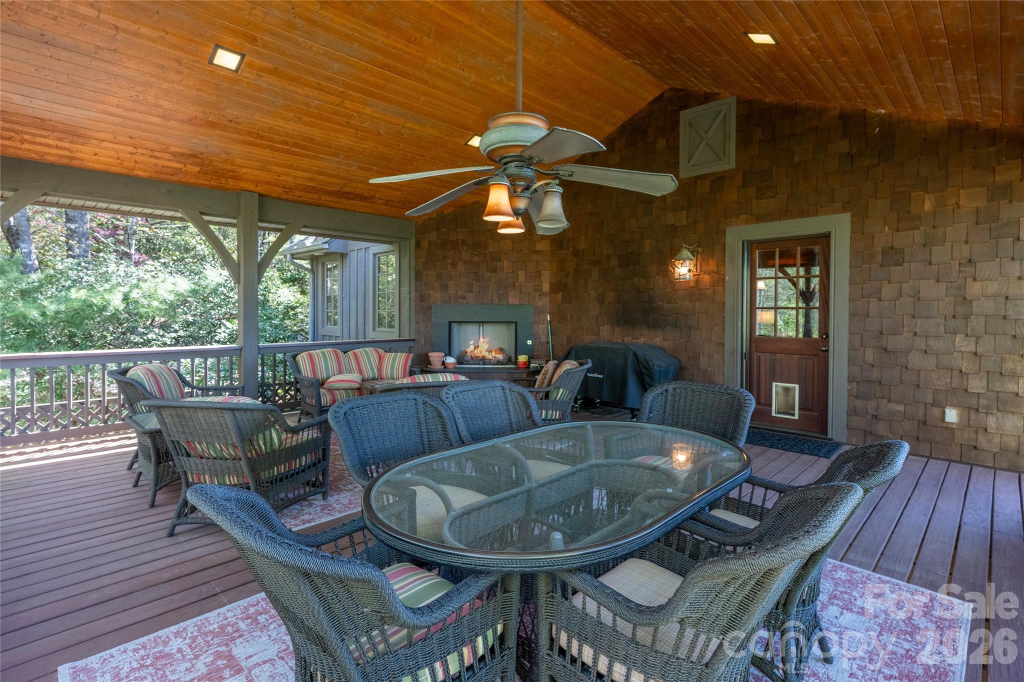 601 Hawk Mountain Road Lake Toxaway, NC 28747 - Photo 23 of 48 a view of a dining room with furniture wooden floor and chandelier