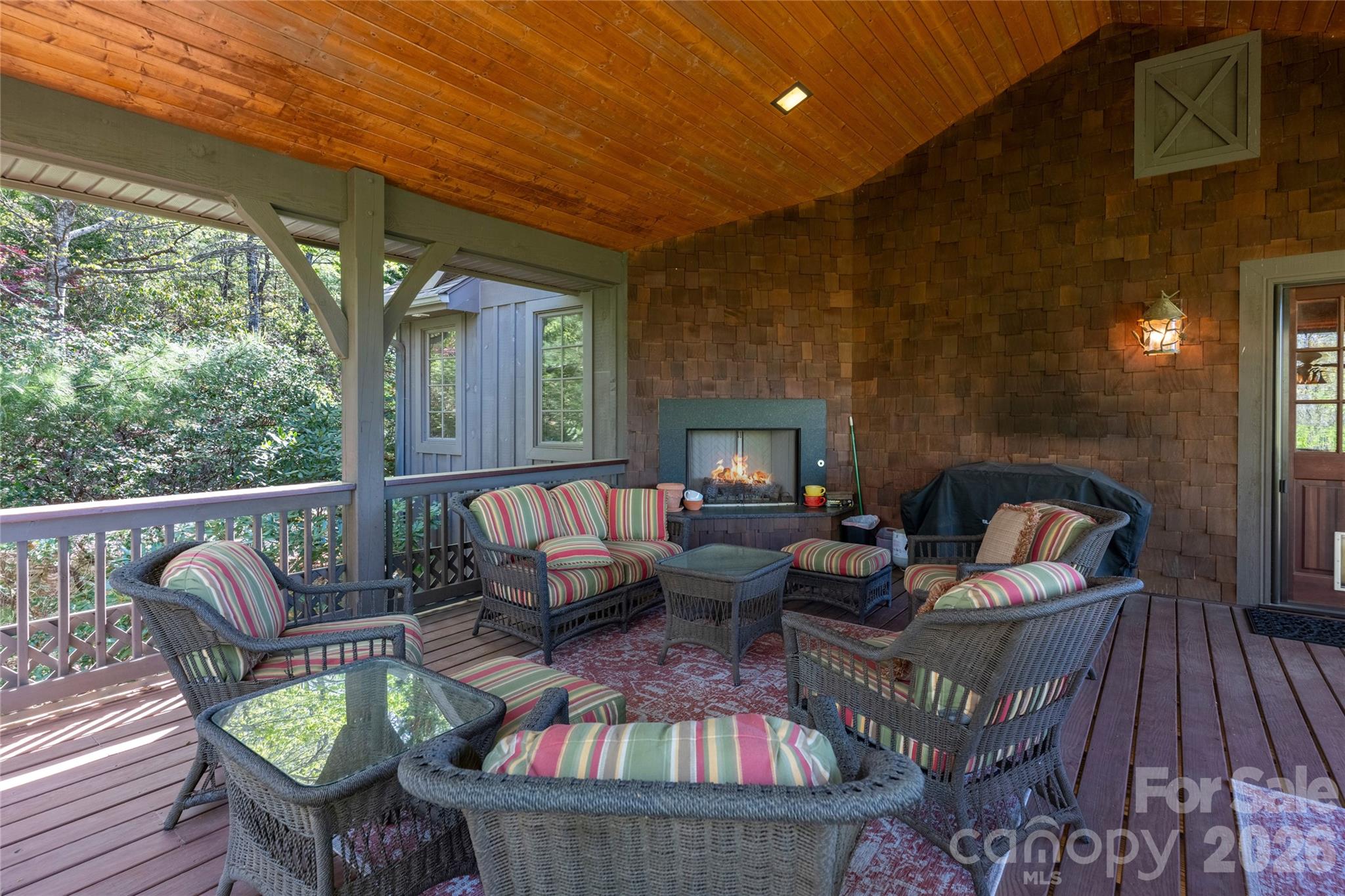 601 Hawk Mountain Road Lake Toxaway, NC 28747 - Photo 24 of 48 a outdoor living room with furniture and a fireplace